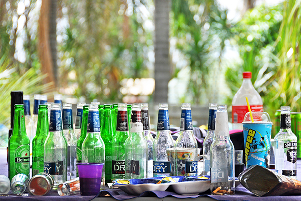 a table full of empty beer bottles