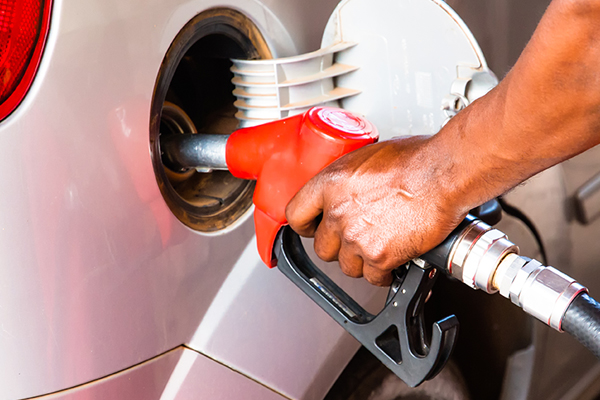 a man pumping gas