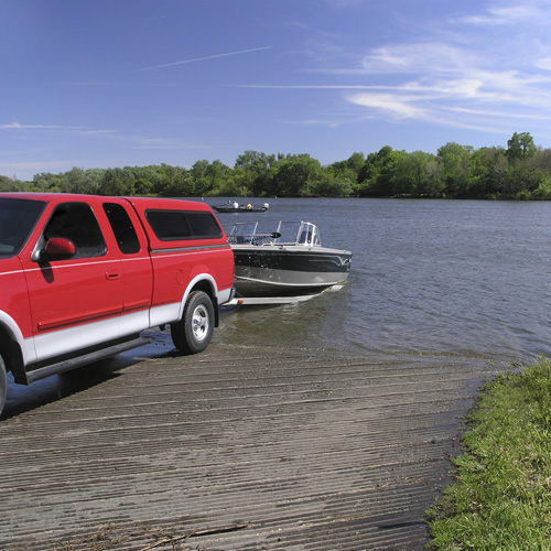 a boat being deployed into a lake