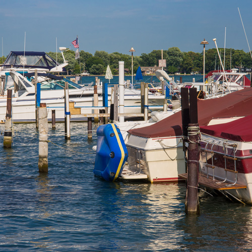 a group of boats at a marina