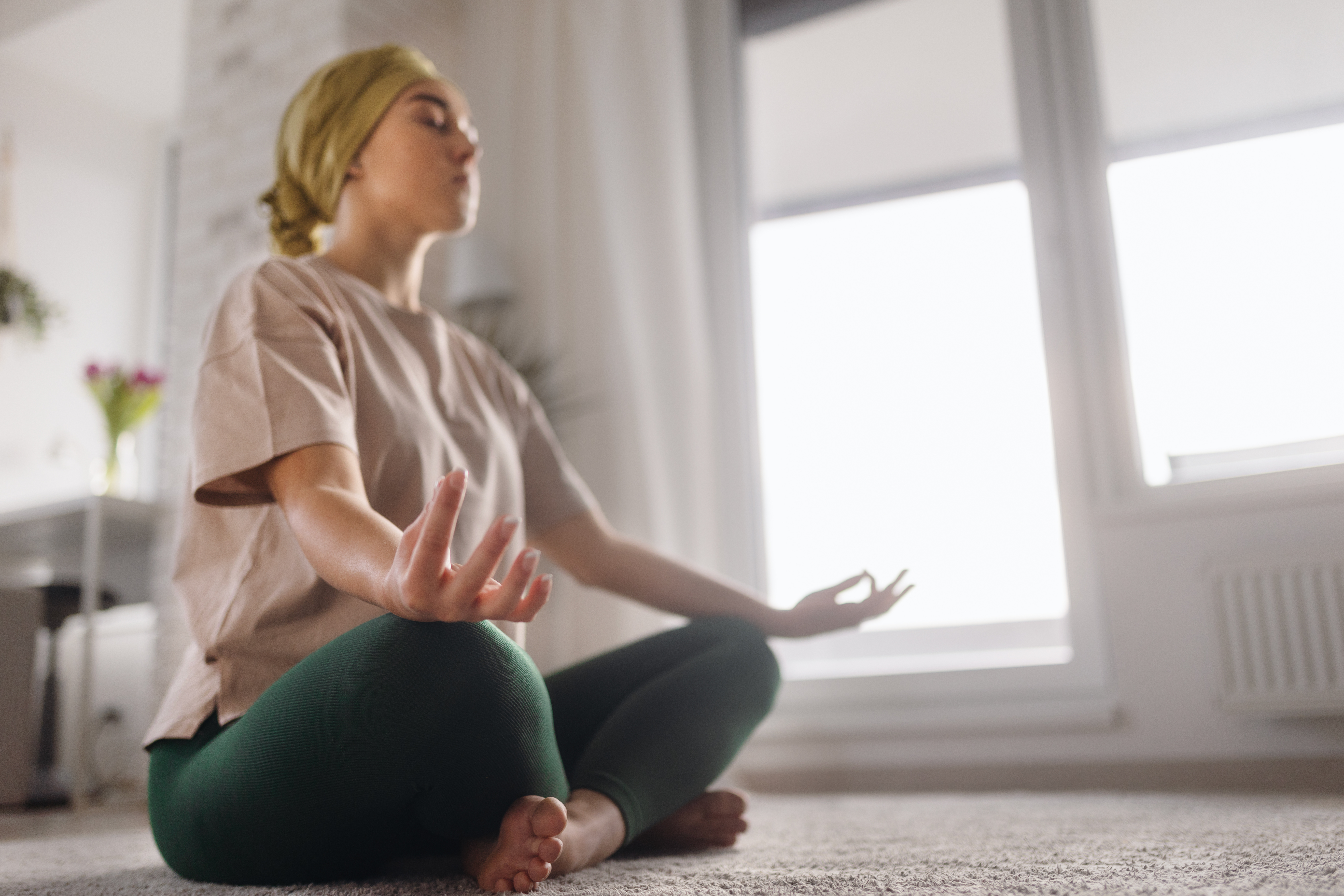 person with cancer next to exercise ball